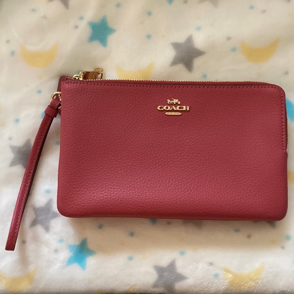 Coach Handbags - Coach pink wristlet. Never used. Great condition.